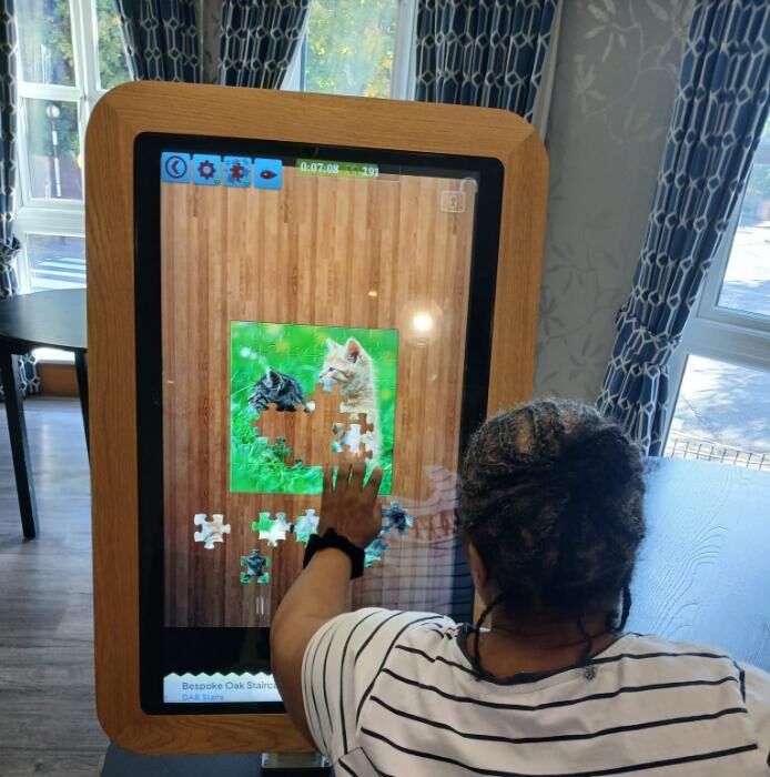 resident interacting with digital puzzle game
