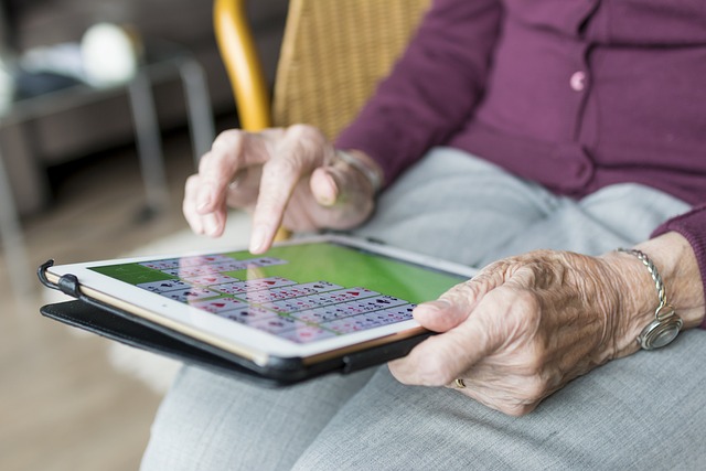 resident playing solitare on ipad