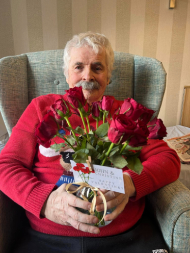 resident with a bouquet