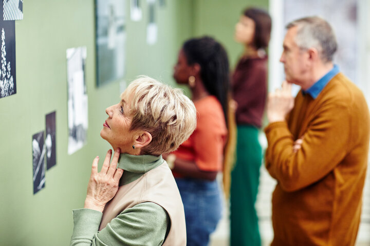 people looking at an art gallery