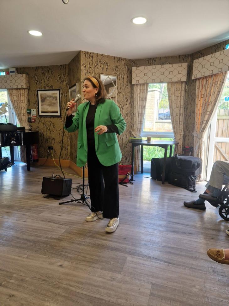 entertainer singing in care home