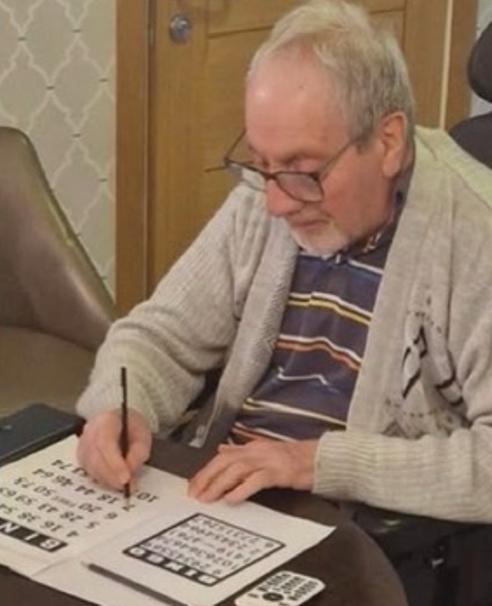 jo doing a cross word in the care home