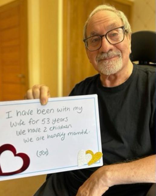 jo with a sign about himself