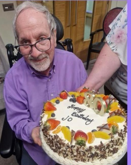 resident with birthday cake