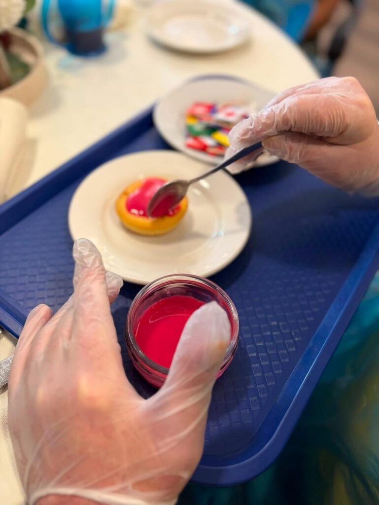 resident decorating a cake
