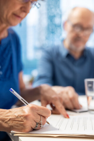 older people signing contracts for care homes