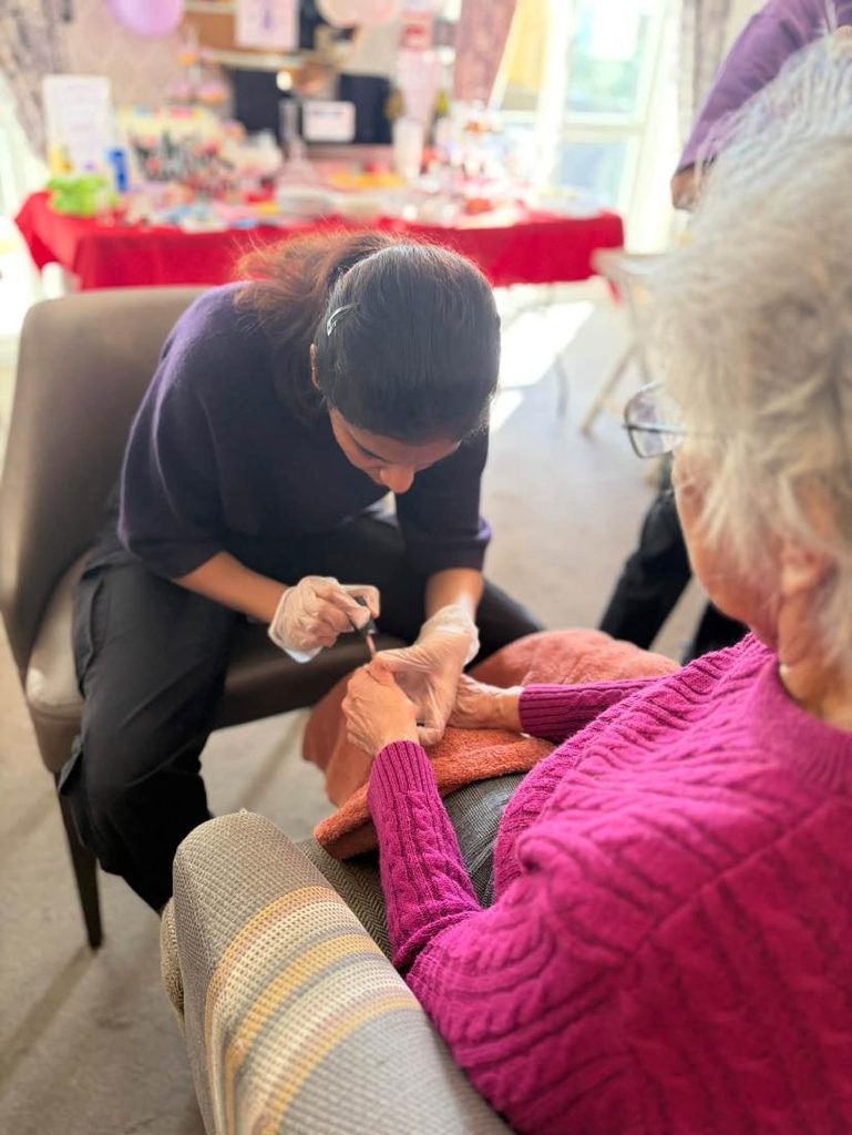 resident getting nails painted
